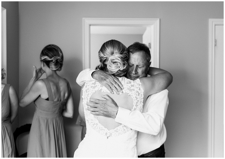 Bride's father hugging her and getting emotional on her wedding day at Credit Valley Gold and Country Club