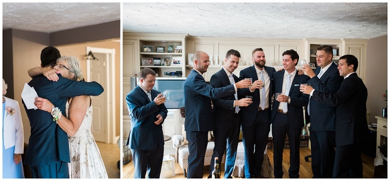 Groom and his groomsmen cheersing with drinks in the living room