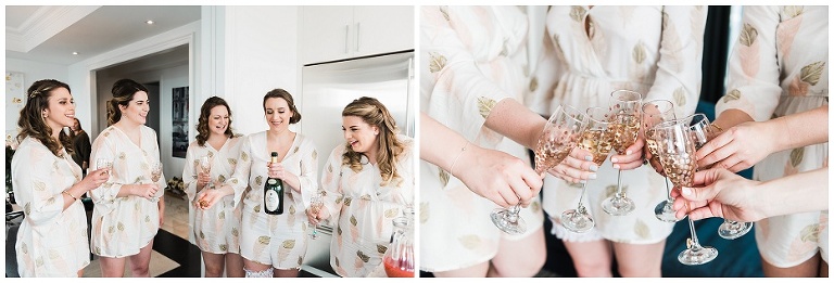 Bride popping champagne bottle with bridesmaids in kitchen of Four Season Hotel Private Residences