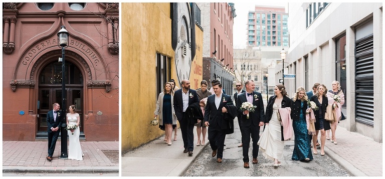 Wedding party walking down Toronto street by the Gooderham Building for wedding photographs