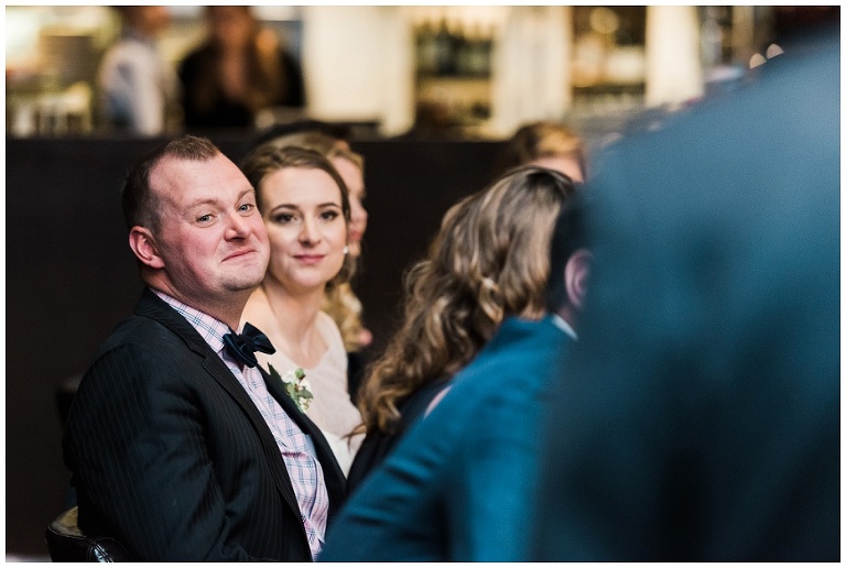 Emotional groom reacting to speech at Jup Restaurant wedding