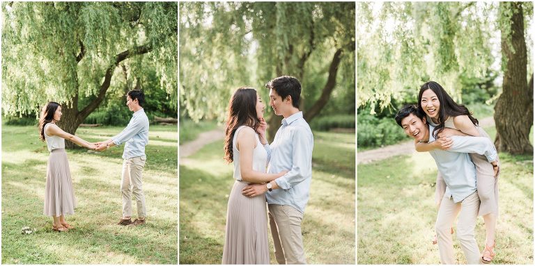 Couple is piggybacking in a park in from of a willow tree