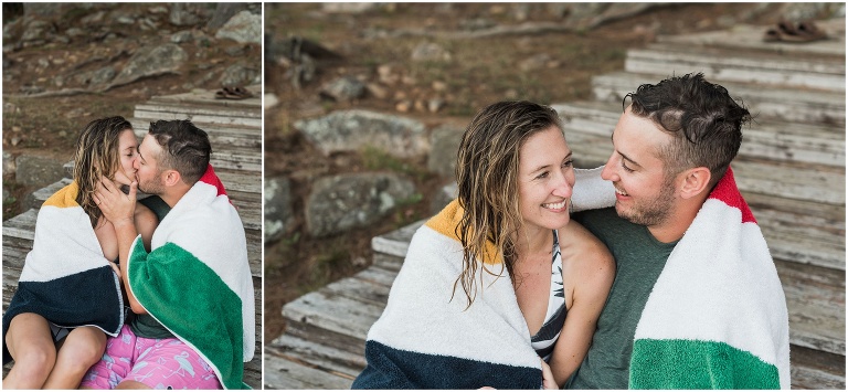 Couples snuggle on the dock in Hudson's Bay towel after getting out of the lake at their Muskoka cottage