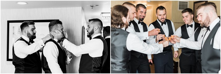 Groom and groomsmen cheering their drinks before leaving their hotel room on the way to Ancaster Mill wedding
