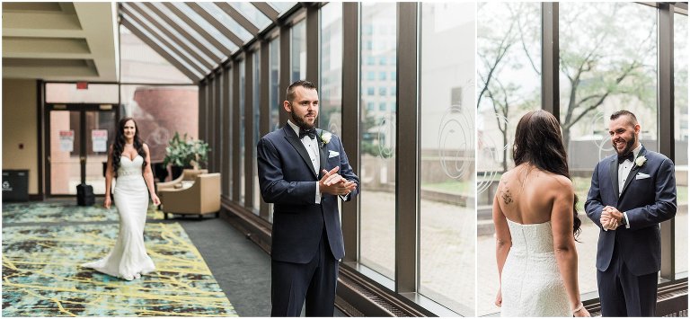 Groom anticipating bride walking up to him for first look inside of Sheraton Hotel Hamilton on their wedding day