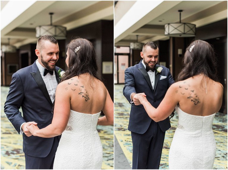 Groom witha huge smile on his face after he has his first look with bride in the Sheraton hotel Hamilton on their Ancaster Mill wedding day