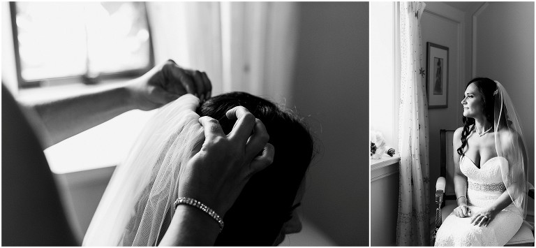 Close up photo of bridesmaid putting in bride's veil