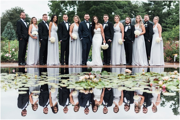 Full wedding party photo at reflecting pond at Royal Botanical Gardens in Hendrie Park