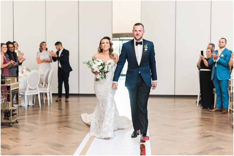 Bride and groom enter reception at Arlington Estate wedding