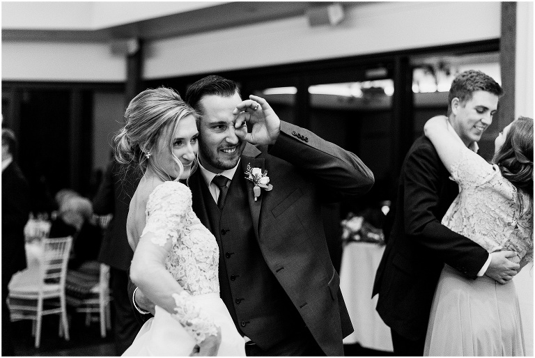 Black and white photo of bride and groom having fun on the dance floor at their elegant Credit Valley Golf and Country Club wedding