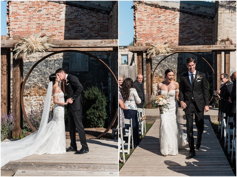 Bride and groom have their first kiss at Elora Mill The Riverside Chapel