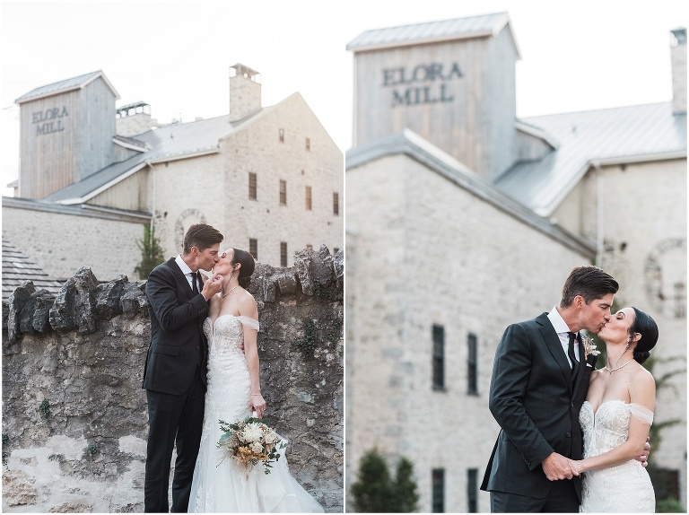 Outdoor photos of bride and groom kissing in front of the main building at the Elora Mill Hotel and Spa