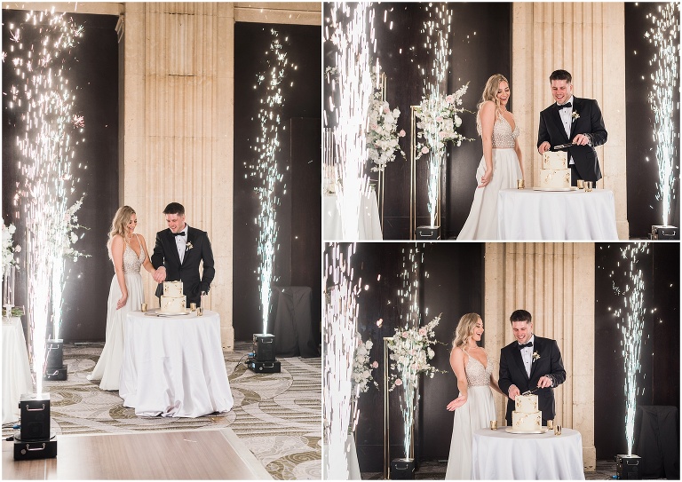 Bride and groom cu cake while cold sparks fly around them