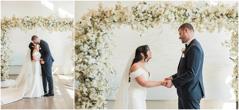 Bride and groom having their first kiss during their wedding ceremony at the pearle hotel