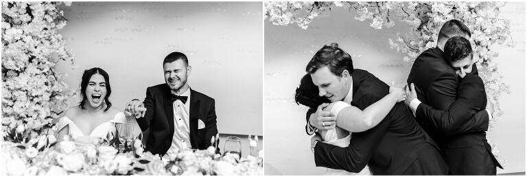 Bride and groom laughing together at their sweetheart table during their wedding reception